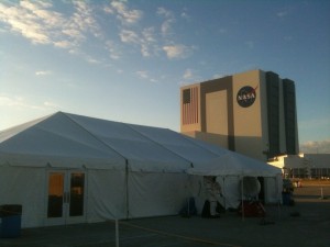 Nasa TweetUp Tent with VAB in background lit by the sunset